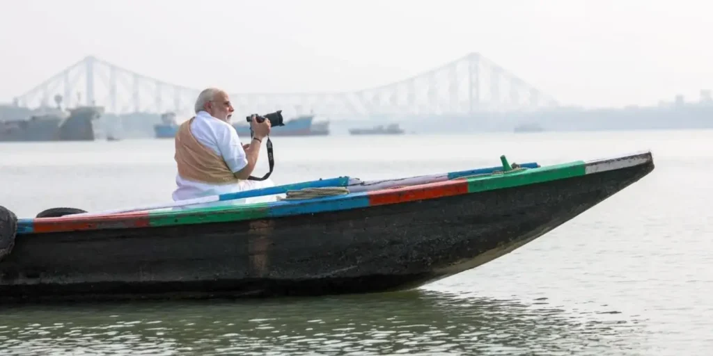 PM takes boat ride on Hooghly river in Kolkata, tries his hand at photographing
